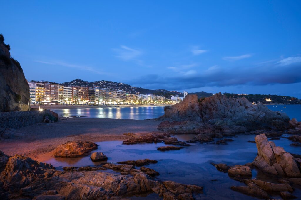 Spain, Catalonia, Lloret de Mar town on Costa Brava, beach and sea shore at night