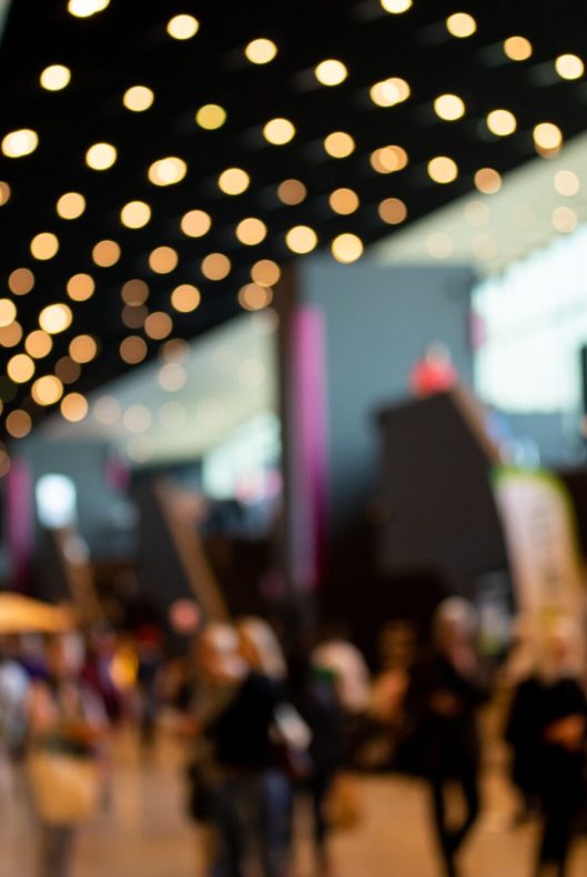Blurred crowd of people in modern interior during event